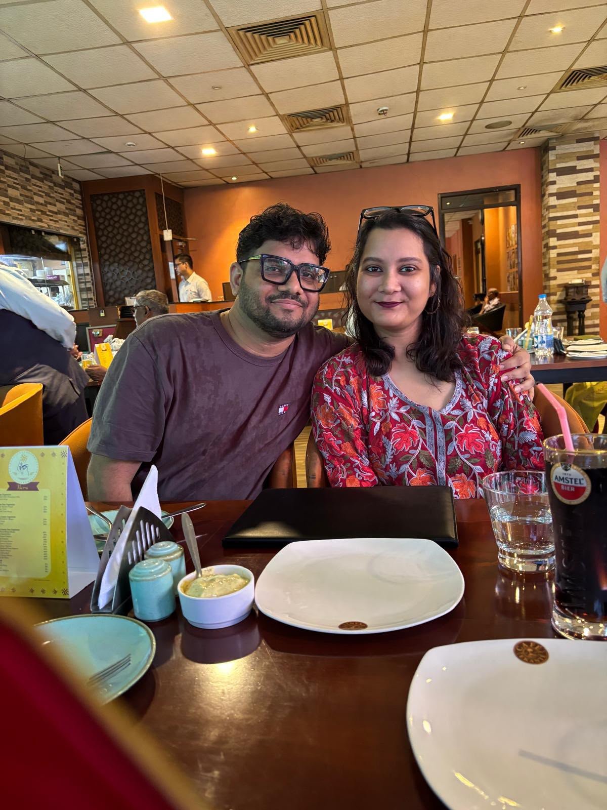 Zinia and Misbahul sharing a quiet restaurant moment