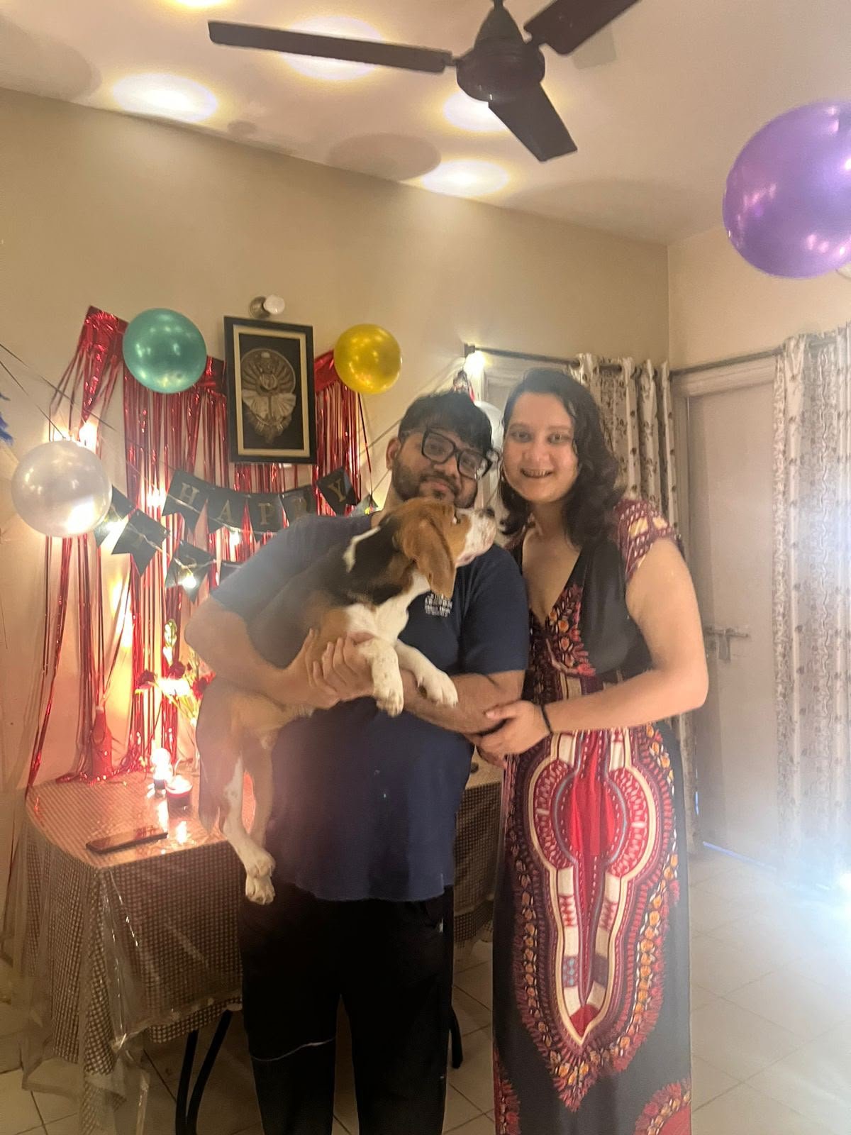 Zinia and Misbahul celebrating with their pet